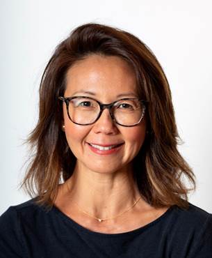 A person posing for the camera

Description automatically generated